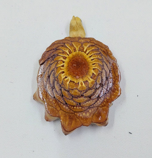 Handcrafted pendant from real pinecones, which are natural and coated in resin. 
