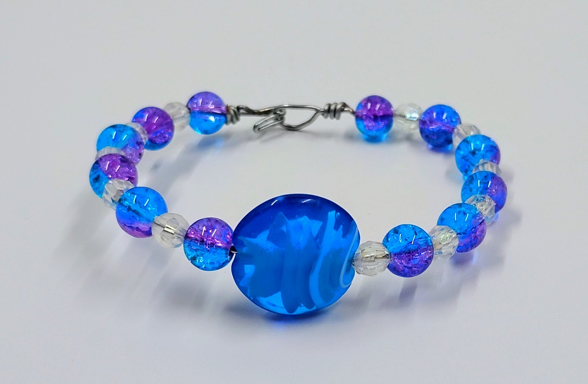 Handcrafted blue, purple and clear beaded bracelet