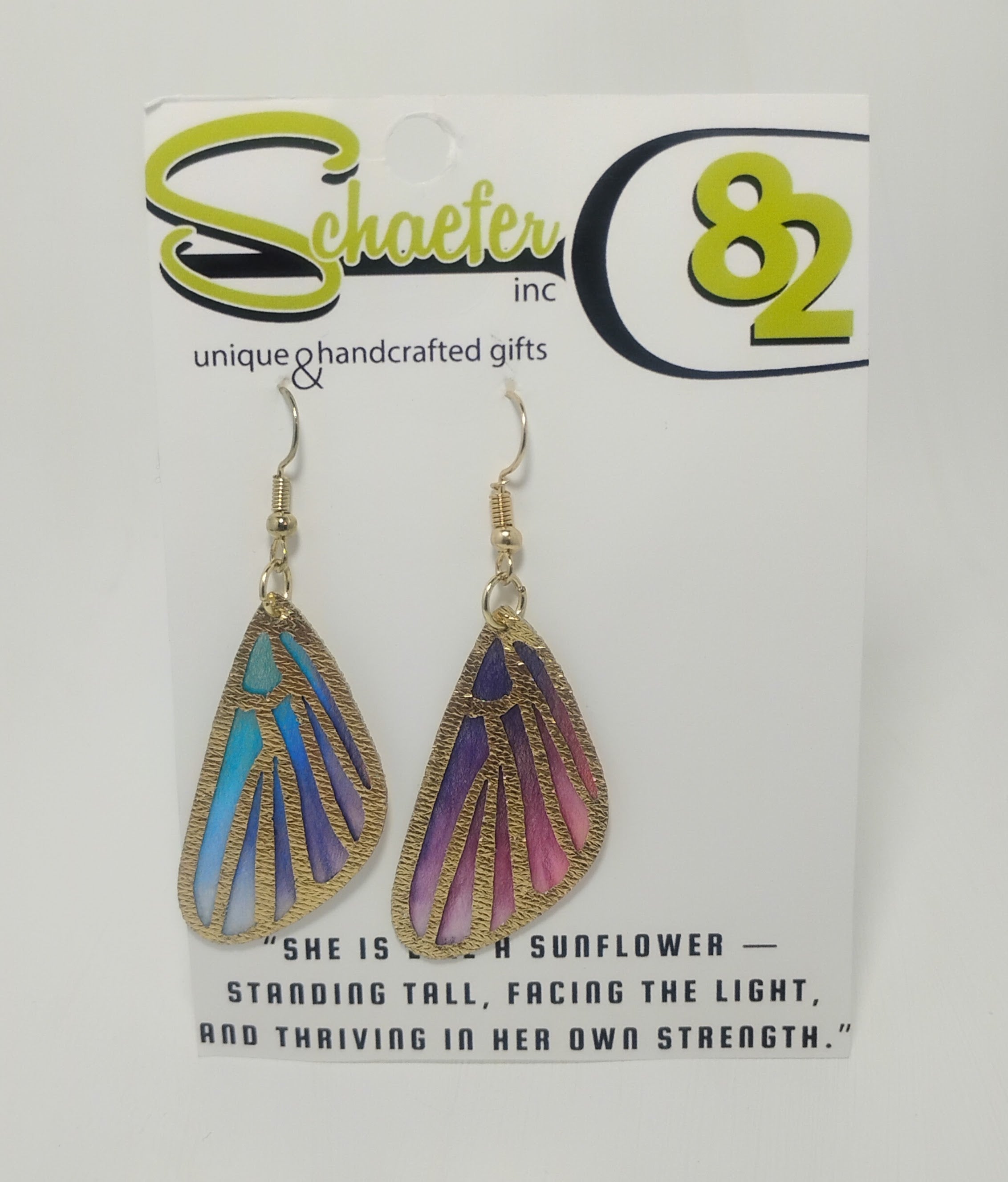 Handcrafted fabric butterfly wings with the colors of pink, purple, and blue with gold accents