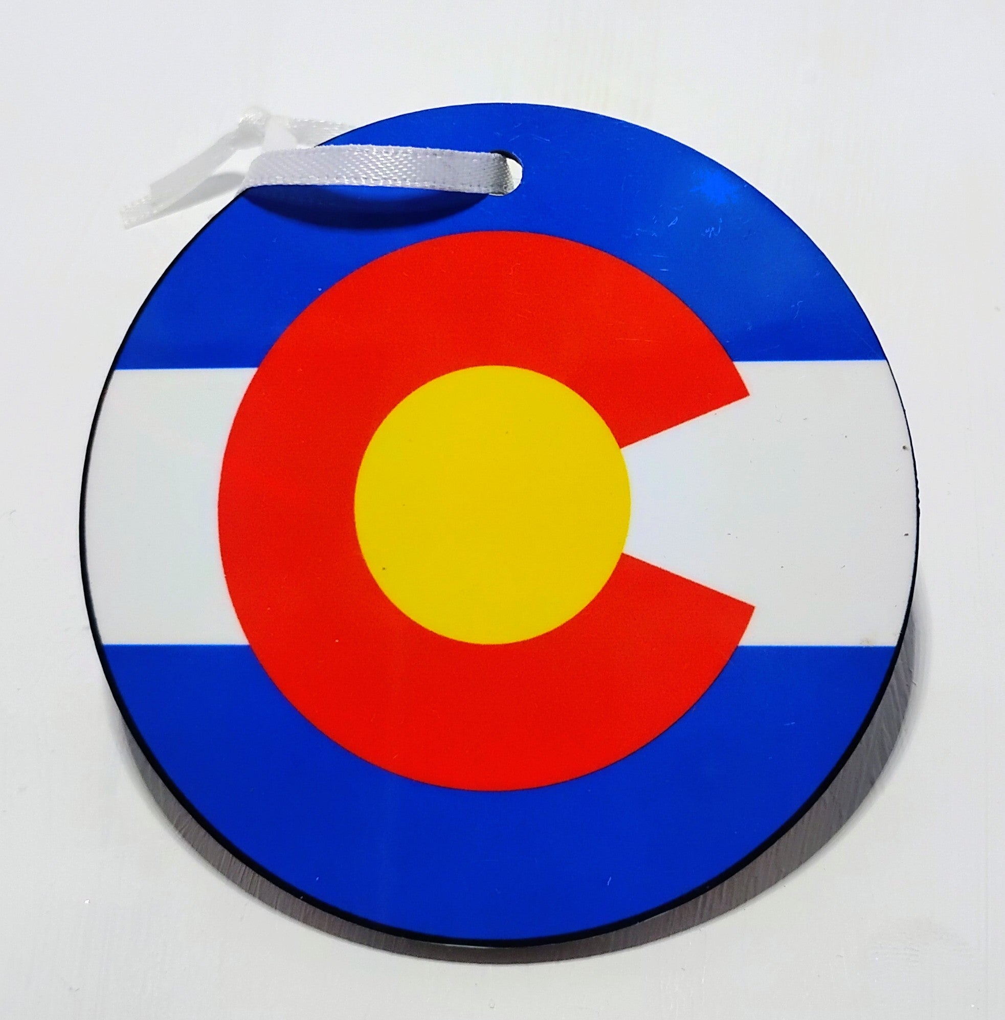 Colorado flag sublimated on a Christmas Ornament.