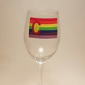 Handcrafted wine glass with the rainbow pride flag, made to resemble the Colorado flag.