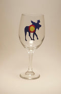 Handcrafted wine glass with a moose design, which is made to resemble the Colorado flag.