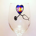 Handcrafted wine glass with a stethoscope design, forming a heart, filled with the Colorado flag.