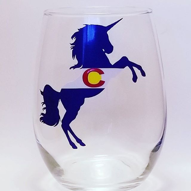 Handcrafted stemless wine glass with a unicorn design which is made to resemble the Colorado flag.