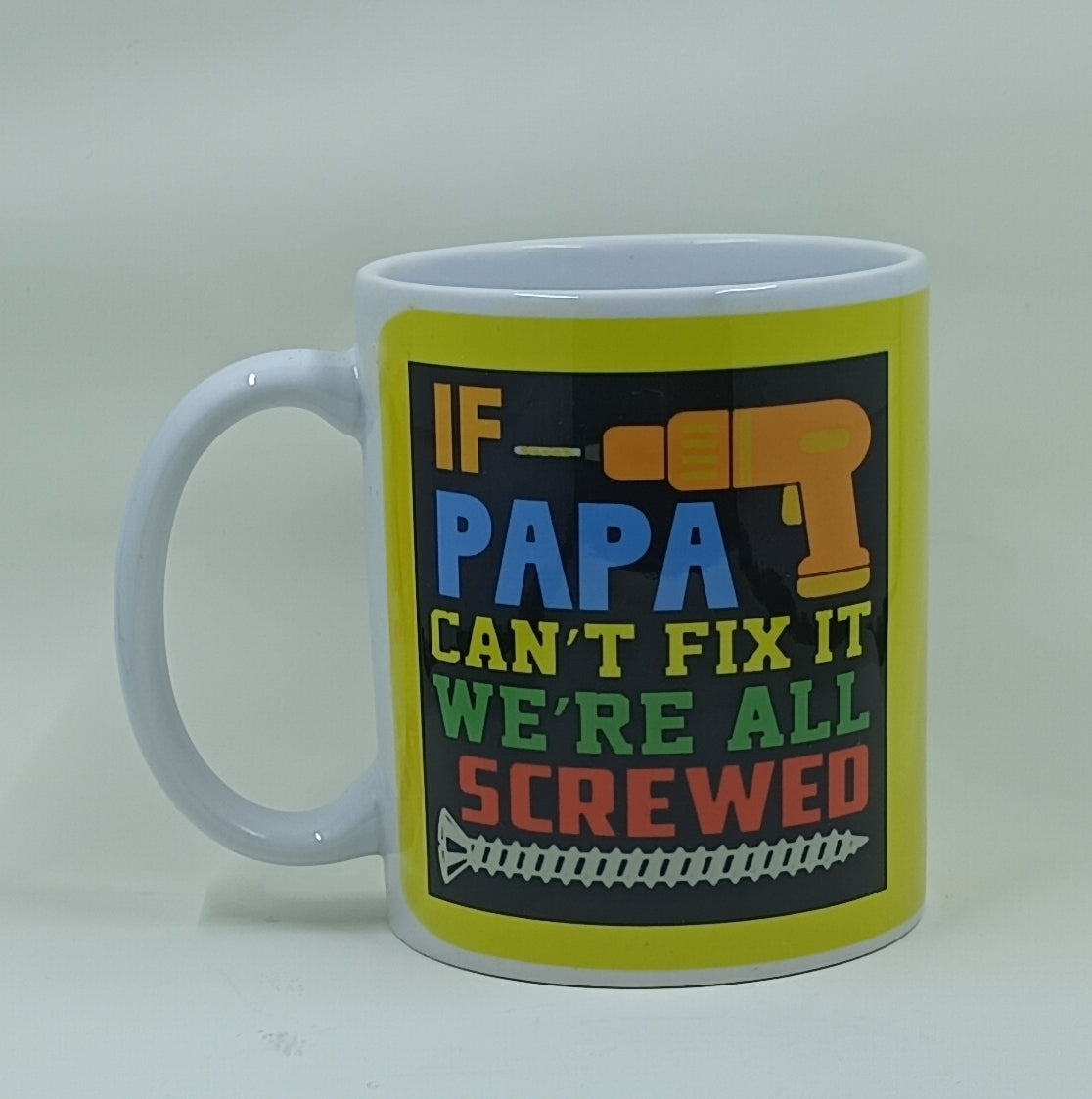 Handcrafted coffee mug with a colorful design and the quote "If papa can't fix it, we're all screwed."