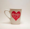 Handcrafted coffee mug with a large heart and the quote "Gigi, another word for love". 