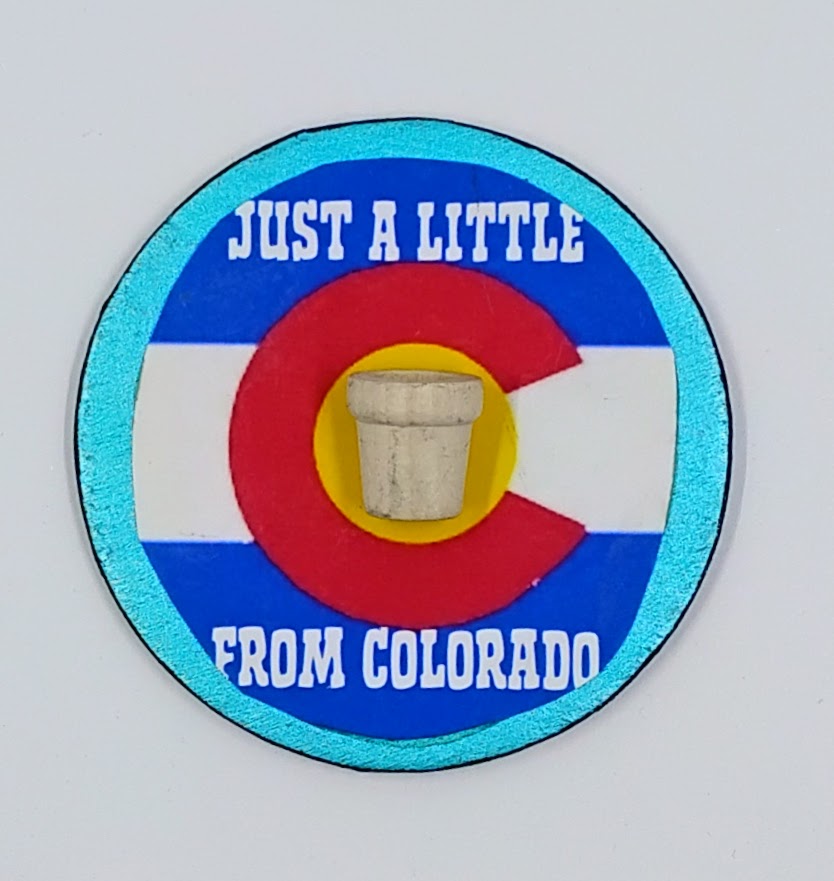 Hancrrafted Colorado flag magnet that says just a little pot from Colorado.