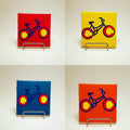 Handcrafted colorful coasters with a bike design, which is made out of the Colorado flag. 