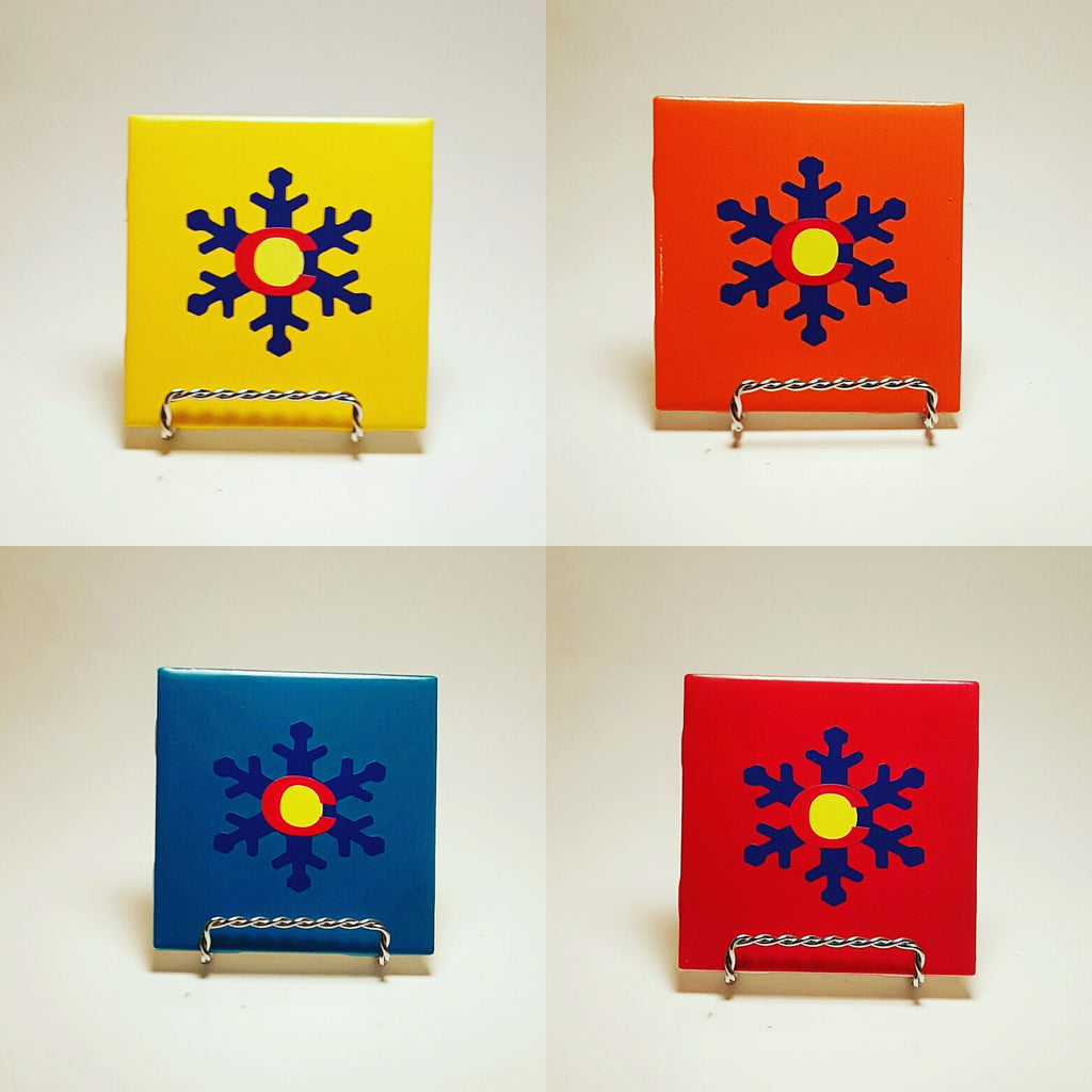 Handcrafted and colorful coasters with a snowflake design that actually makes the color flag as well