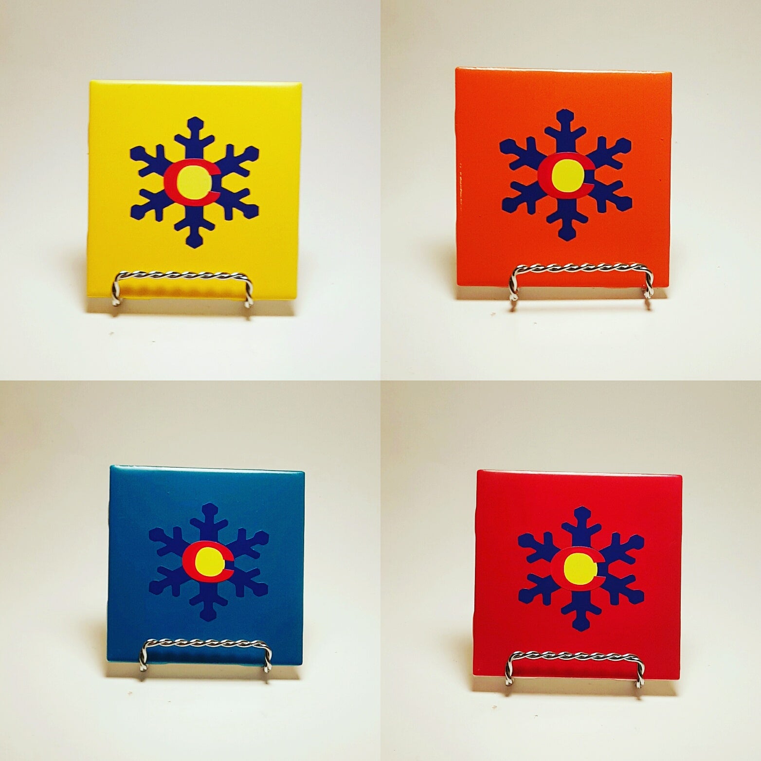 Handcrafted and colorful coasters with a snowflake design that actually makes the color flag as well