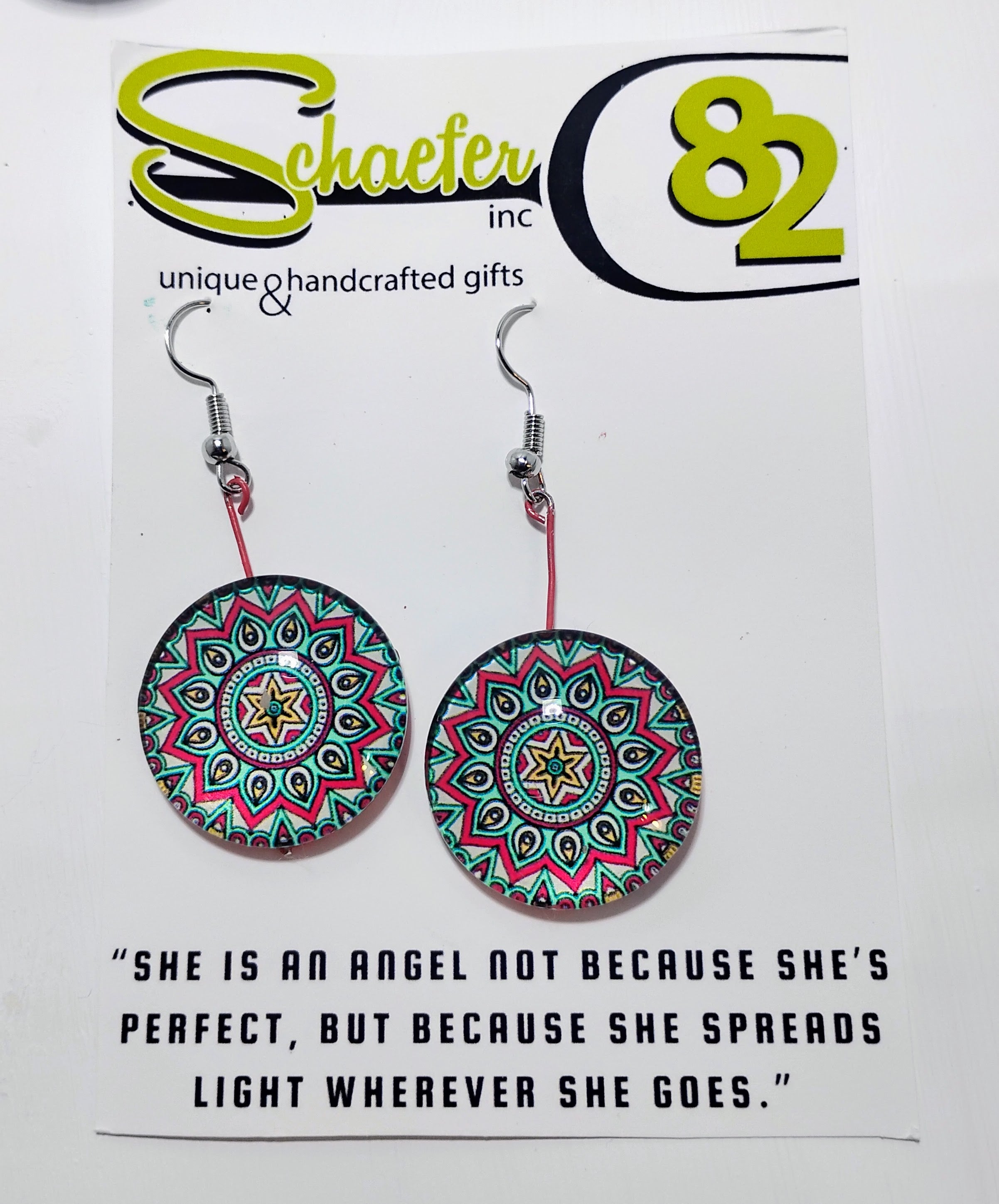 Handcrafted Radiant bloom mandala earrings, with bright greens, red, and yellows. 
