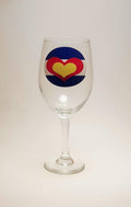 Handcrafted wine glass that has the Colorado flag, made out of hearts. 