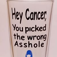 Standard beer glass with the handcrafted unique design that says "Hey cancer, you picked the wrong *sshole" and has a blue ribon