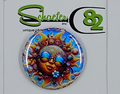 Small circular hat pin with a very colorful hippy looking sun wearing rainbow glasses