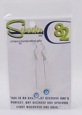 Handcrafted Evil eye earrings, which have the eyes on white shells. 