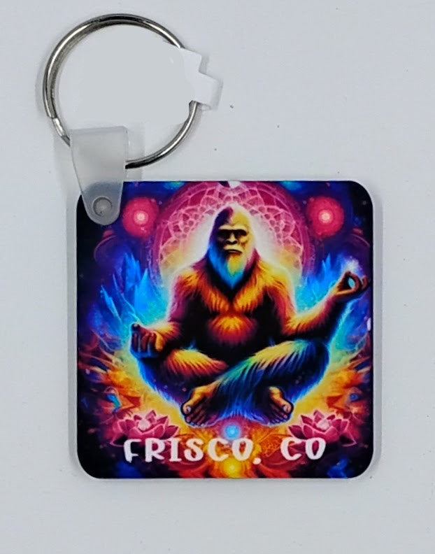 Colorful keychain with a bigfoot mediating in the air