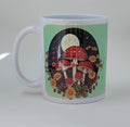 Green coffee mug with a night background showcasing mushrooms, flowers and the moon