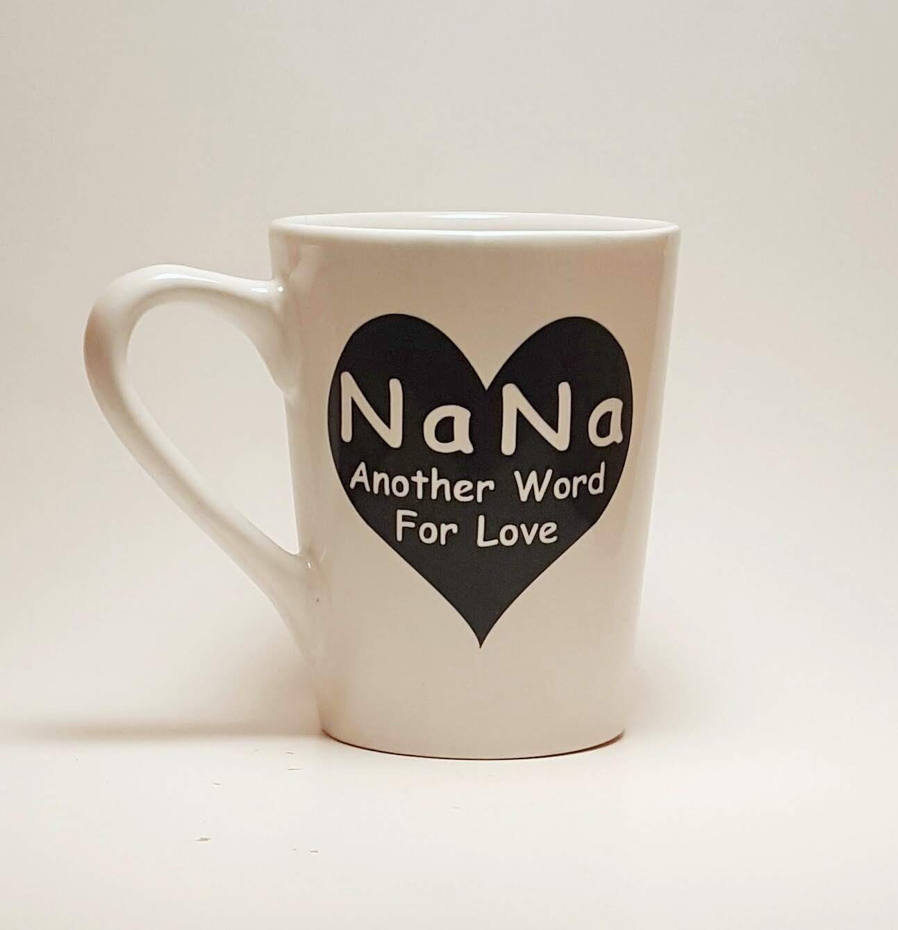 Handcrafted coffee mug with a large heart design and the quote "Nana, Another word for love'"