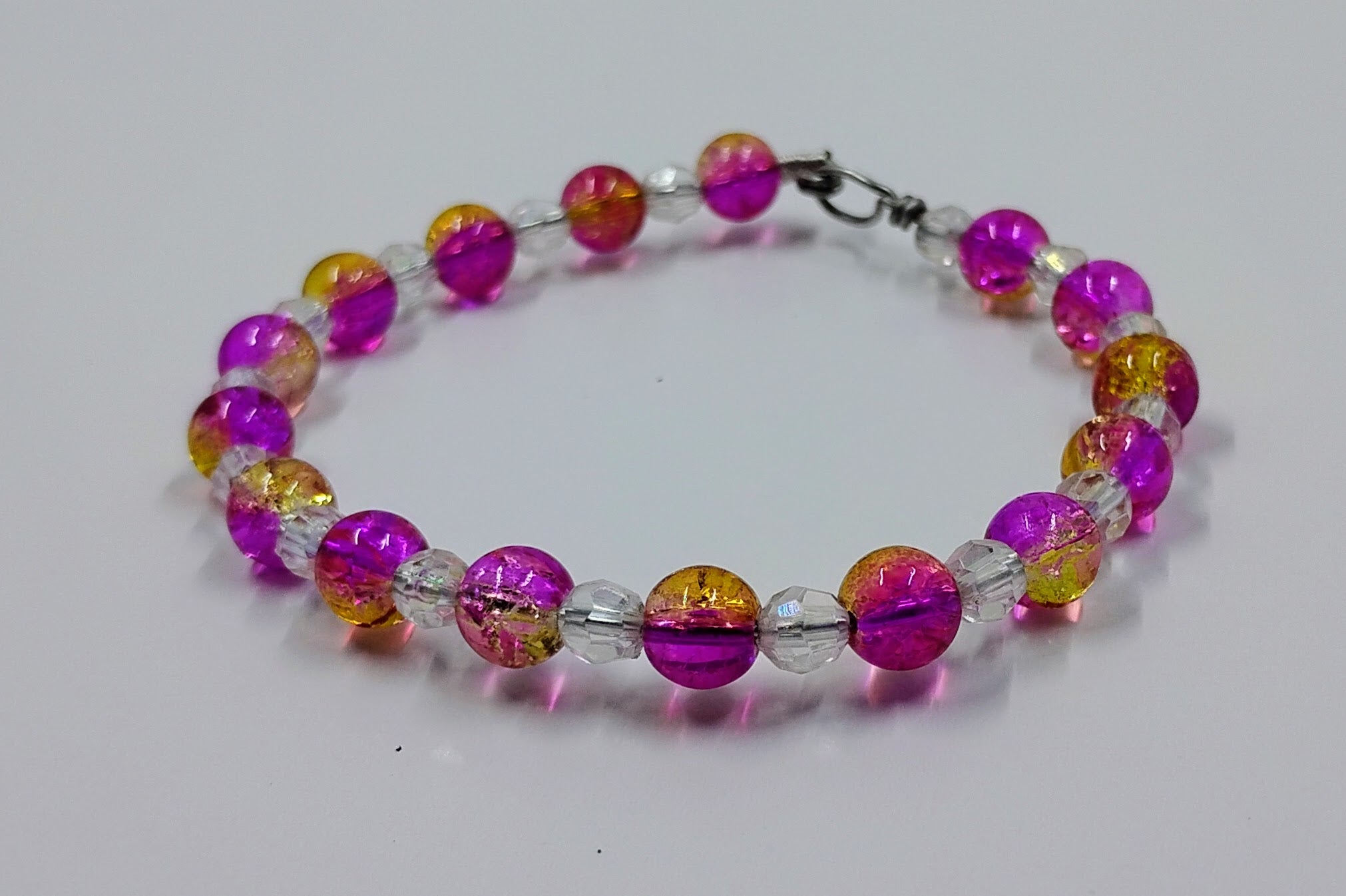 Handcrafted pink, yellow and clear beaded bracelet