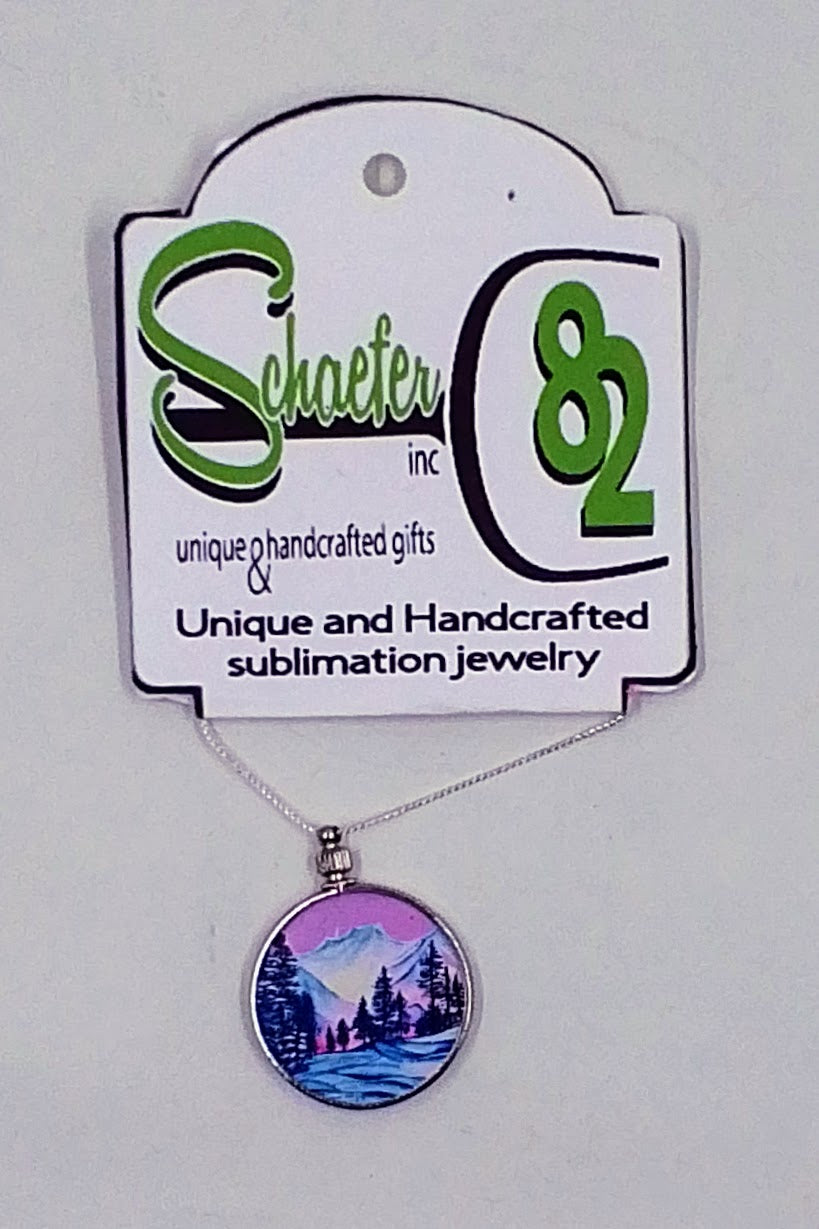 Beautiful handcrafted mountain necklace with a purple backdrop