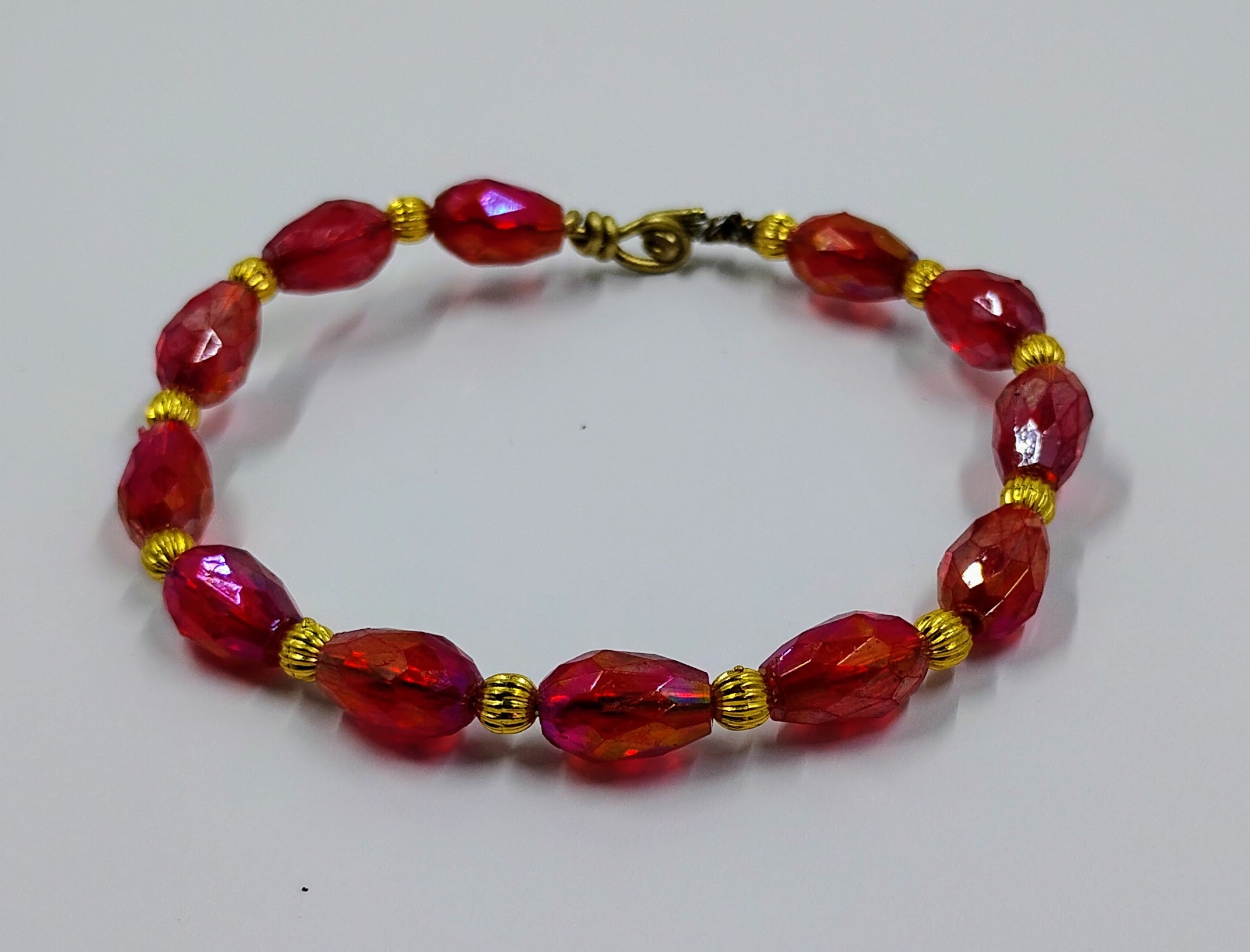 Handcrafted red and gold beaded bracelet