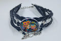 Handcrafted black leather bracelet with a colorful moon and the word love. Very celestial style jewelry.
