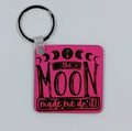 Handcrafted pink square keychain with the saying the moon made me do it