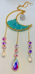 Handcrafted golden moon suncatcher, filled half way with turquoise chips and 13 Iridescent prism beads for creating rainbows. 