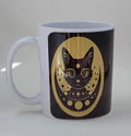 handcrafted coffee mug with a gold and black background and a black cat with moons and stars